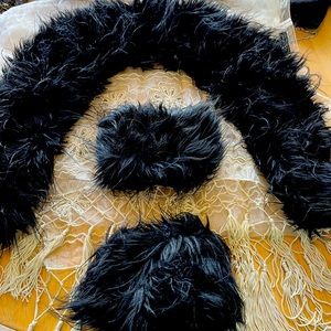 Faux black fur neckline and two cuffs with strong magnets to dress up anything.